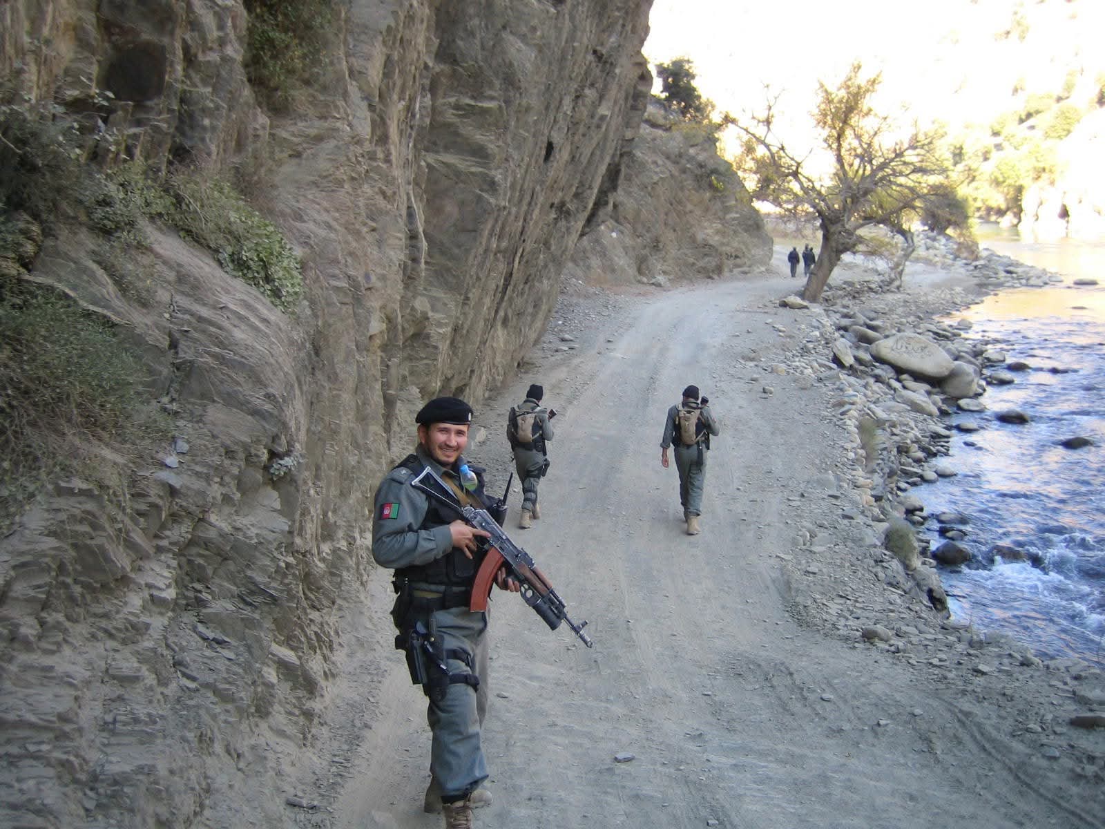 Mosa Rahimi and fellow officers on patrol in mountainous terrain