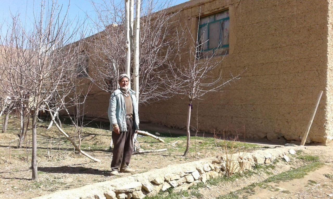 Mosa Rahimi's father standing outside the family home